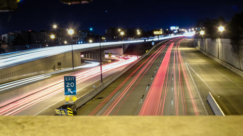 High angle view of light trails on road at night