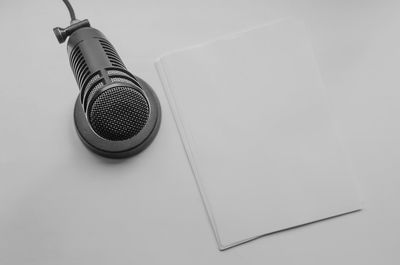 High angle view of electric lamp against white background