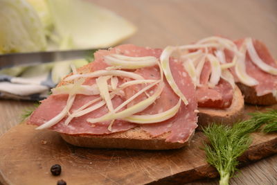 Close-up of chopped bread on cutting board