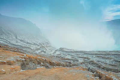 Scenic view of ijen mountains against sky banyuwangi, indonesia