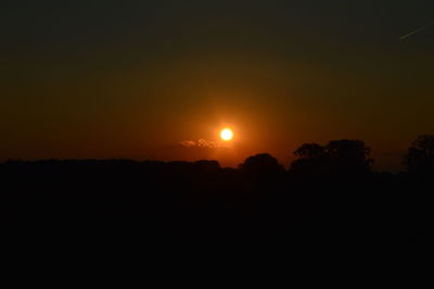 Scenic view of silhouette landscape against sky during sunset