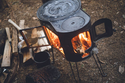 High angle view of fire on barbecue grill