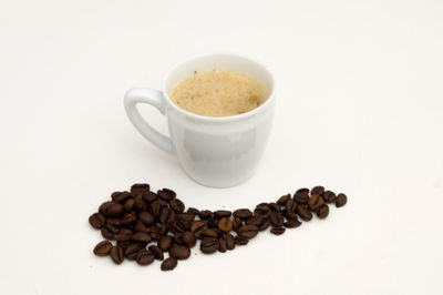 Close-up of coffee beans against white background