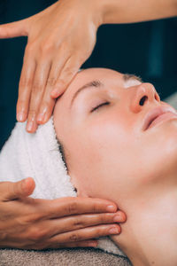 Close-up of woman getting massage therapy at spa