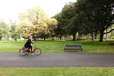 Man riding bicycle in park