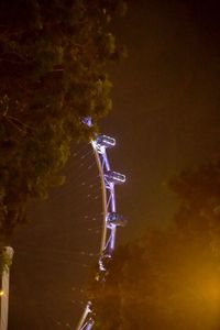 Low angle view of illuminated lights at night