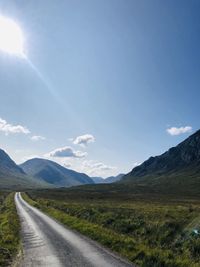 Road amidst landscape against sky