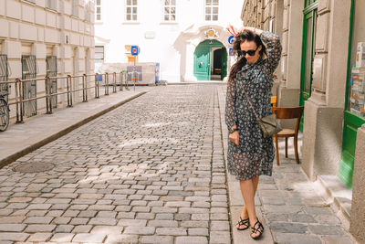 Full length of woman walking on street