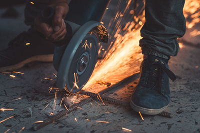 Low section of man working on street