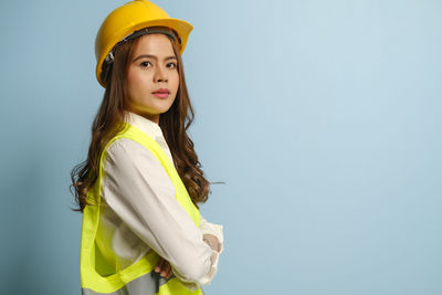 Portrait of a beautiful young woman against white background