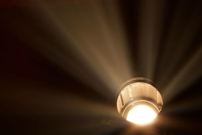 Low angle view of illuminated light bulb