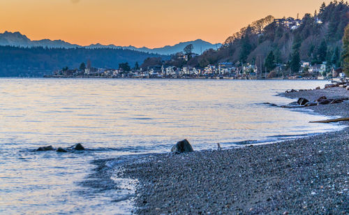 Winter evening shoreline homes at three tree point in burien, washington.