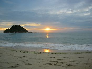 Scenic view of sea at sunset