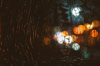 Low angle view of illuminated lantern at night