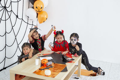 High angle view of people sitting on floor