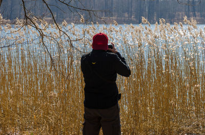 Rear view of man standing against sky