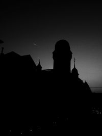 Low angle view of built structure against sky at dusk