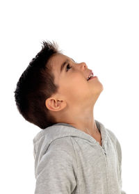 Portrait of young man looking away against white background