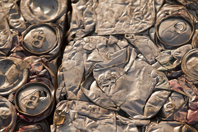 Full frame shot of weathered drink cans