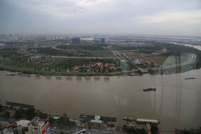 High angle view of river amidst buildings in city