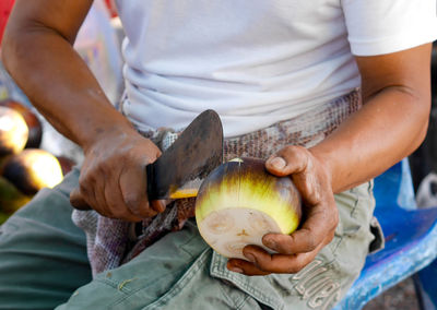 Midsection of man preparing food