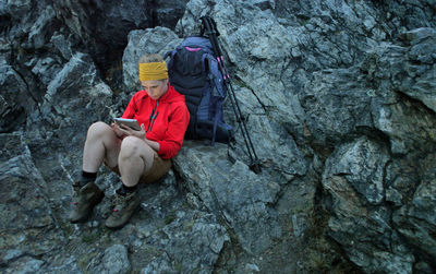 Man sitting on rock