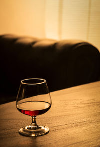 Close-up of wineglass on table