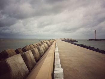 View of calm sea against cloudy sky