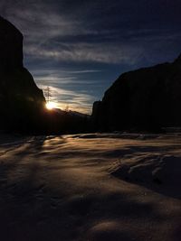 Scenic view of beach against sky during sunset