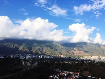 Aerial view of town against sky