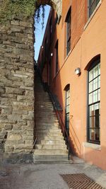 Steps by building against sky