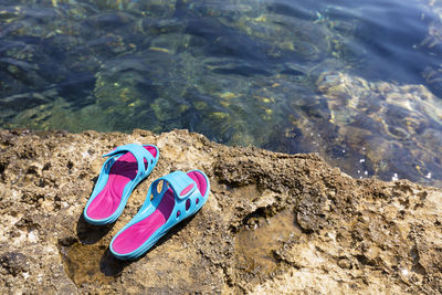 High angle view of shoes on beach