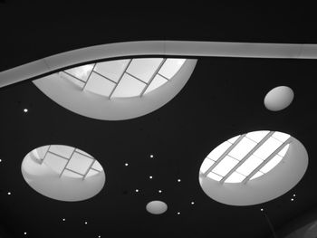 Low angle view of illuminated clock