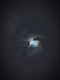 Low angle view of moon in sky at night
