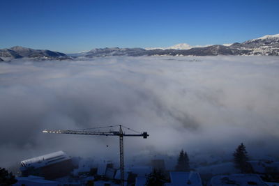 Crane against cloudscape