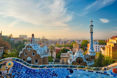 Barcelona city view from guell park. sunrise view of colorful mosaic building in park guell