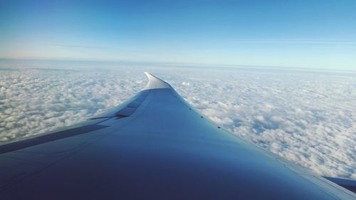 Aerial view of airplane wing against clear sky