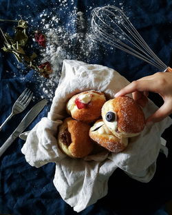 Close-up of hand holding doughnut