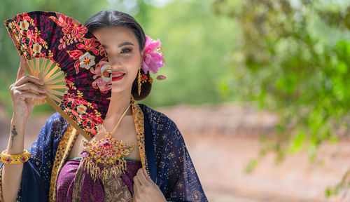 Portrait of young woman in traditional clothing