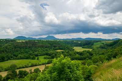 View of the chain of auvergne volcanoes under a thunderstorm