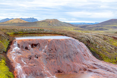 Scenic view of volcanic landscape against sky