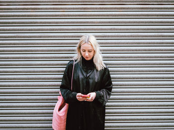 Woman against door