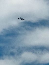 Low angle view of airplane flying in sky