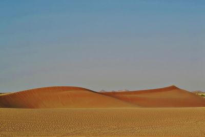 Scenic view of desert against clear sky