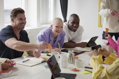 Diverse team brainstorming during business meeting in conference room