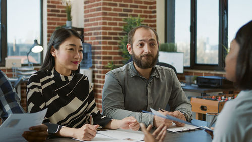 Businesswoman discussing with colleague