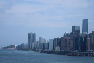 Modern buildings in city against sky