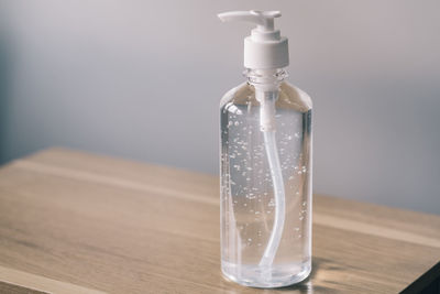 Close-up of glass bottle on table