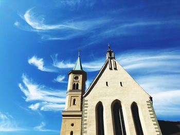 Low angle view of building against blue sky