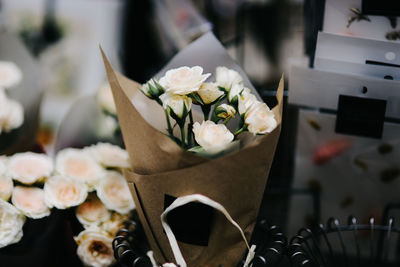 Close-up of white roses on table